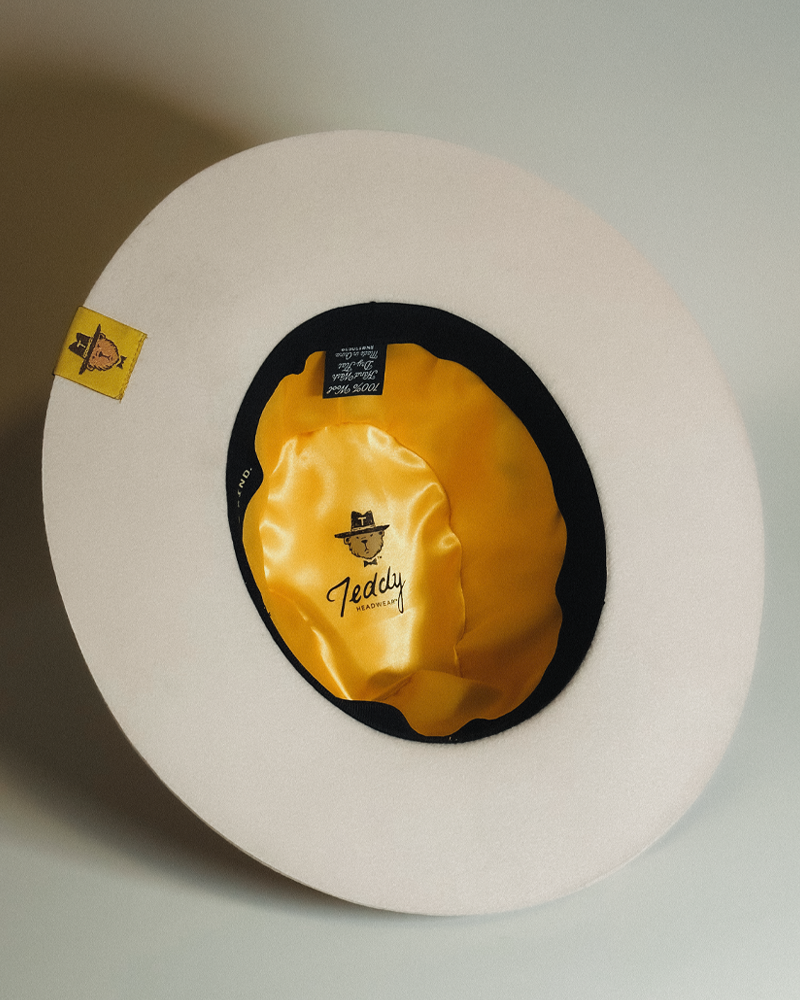 Teddy Headwear fully custom LA Monogram Fedora hat with silk lining and adjustable sweatband and exterior hat band with debossed metal branding.