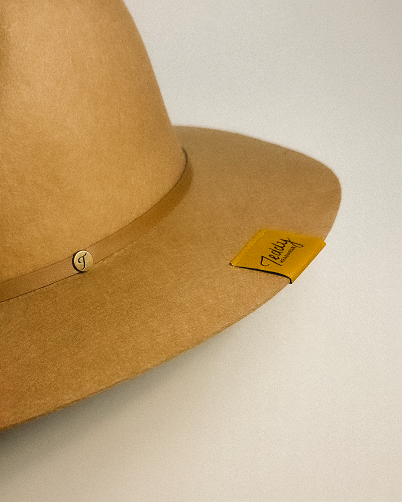 Teddy Headwear detail of exterior woven label on brim of 100% Wool hat, fine crafted and designed in America.
