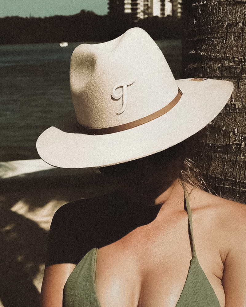 Woman Model wearing Teddy Monogram classic fedora in South Florida with vintage aesthetic and contemporary design.