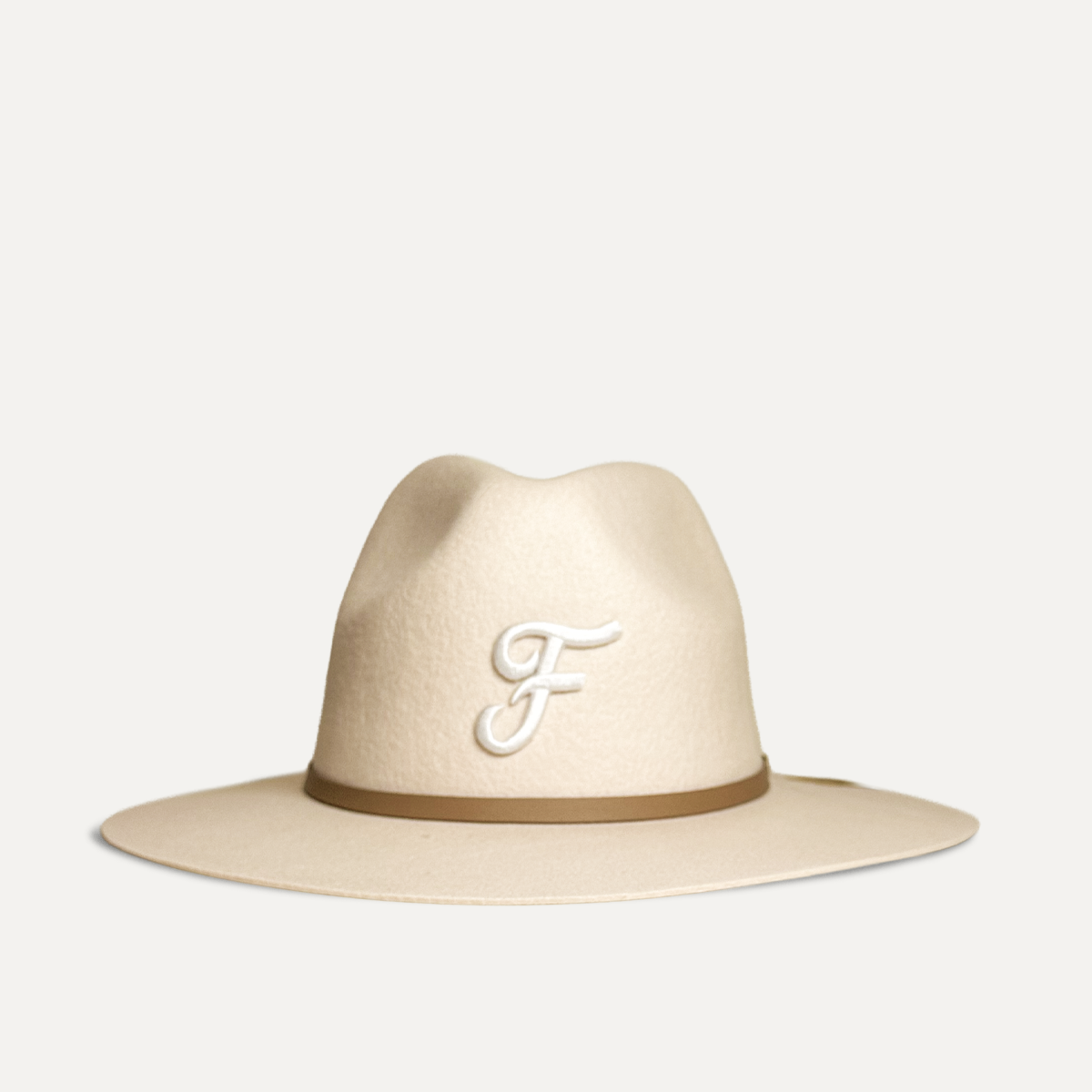 South Florida Fedora, Soft wool fedora with adjustable sweatband and signature Teddy Headwear embroidered design patch, available on sale for the Holidays. Offered in two sizes and colors, cream and brown. 