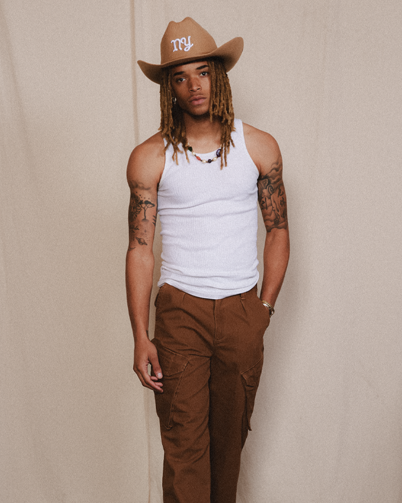 Male model fashion wearing Teddy Headwear brown cowboy hat with NY embroidered.