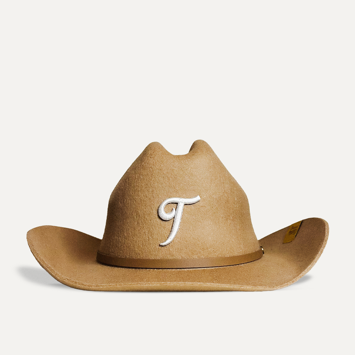 Teddy Headwear Texas monogram 100% wool Cowboy Hat, traditional Western cowboy hat silhouette for unisex in premium cream or brown wool colors, featuring white T embroidery and leather hat adjustable band.