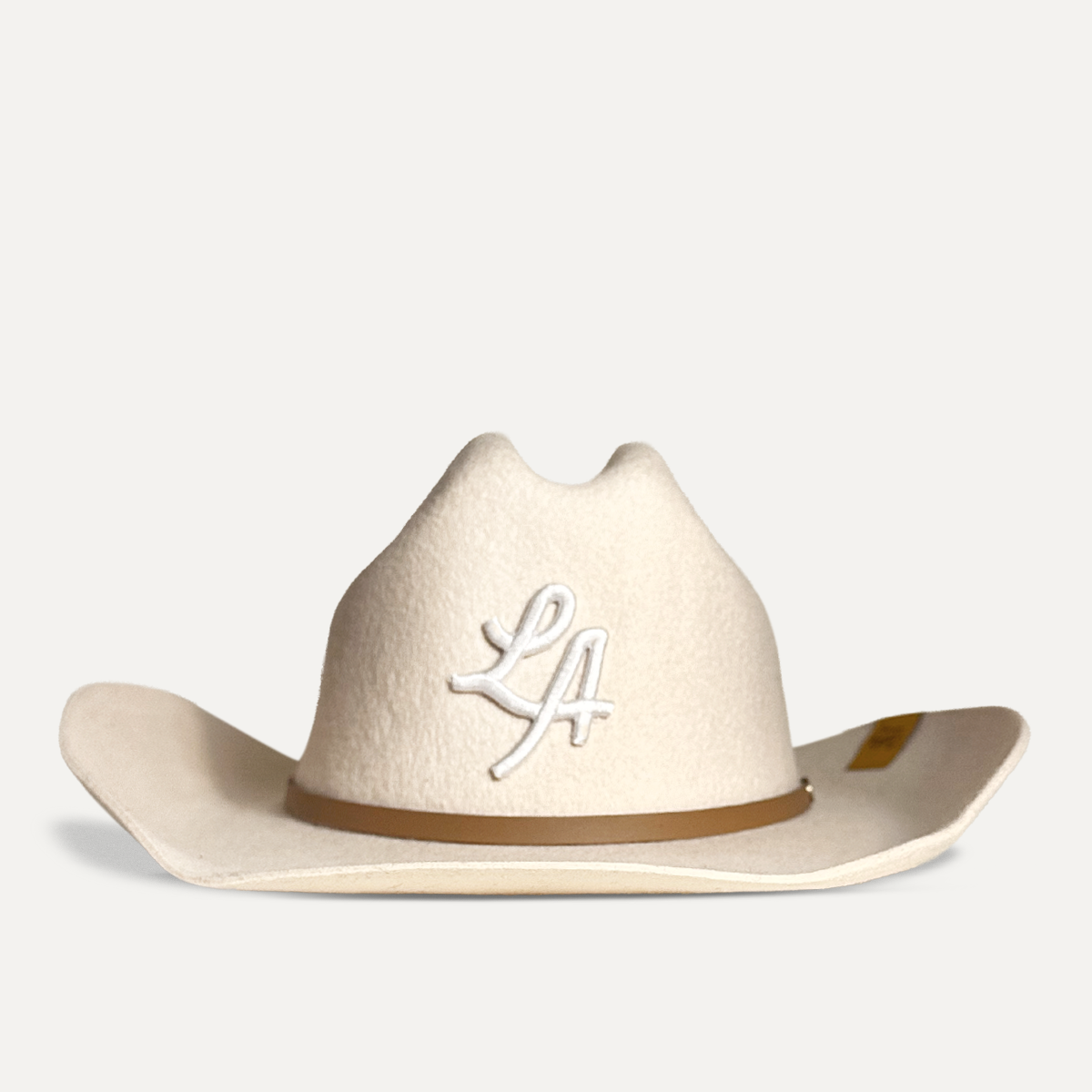 Teddy Headwear Los Angeles (LA) monogram 100% wool Cowboy Hat, traditional Western cowboy hat silhouette for unisex in premium cream or brown wool colors, featuring white T embroidery and leather hat adjustable band.