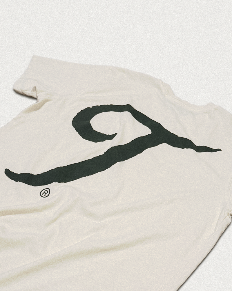 Teddy Headwear detail of the back distressed graphic on 100% recycled cotton short sleeve unisex t shirt in cream. 